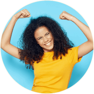 Vitamin Infusions Circle Image Confident person in yellow shirt flexing arms against a blue background, symbolizing increased energy, immune support, and vitality from vitamin infusion therapy.